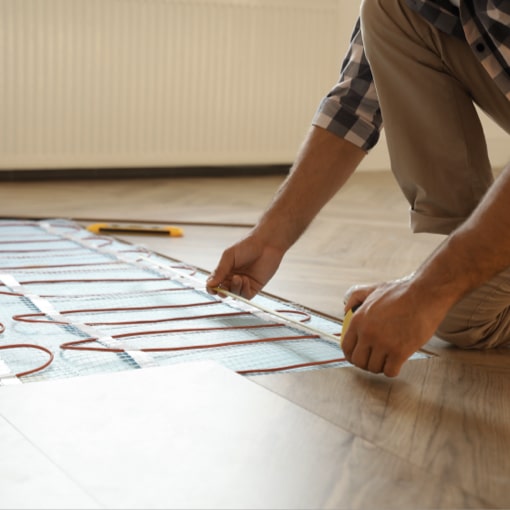 Man measuring floor | Battle Creek Tile & Mosaic