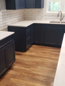 Kitchen vinyl flooring with blue cabinet | Battle Creek Tile & Mosaic