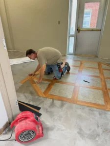 Installing floor | Battle Creek Tile & Mosaic